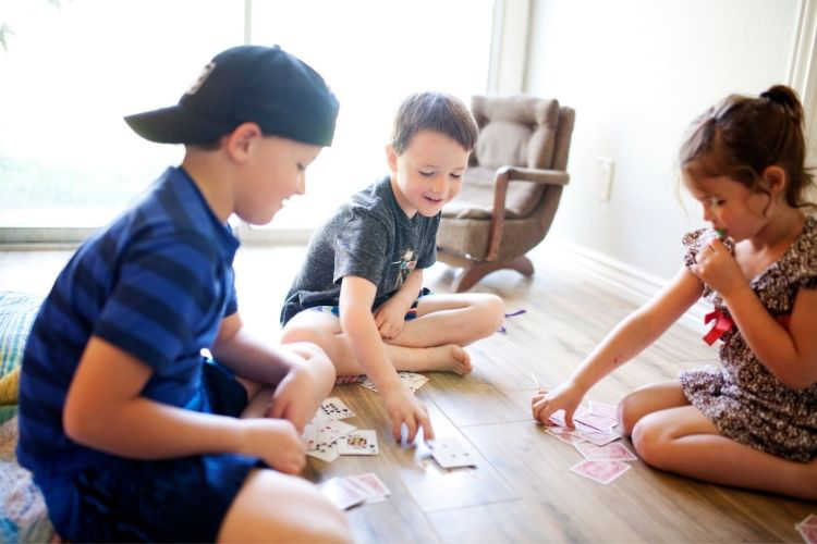 Kids playing cards on vacation-Multigenerational Vacation