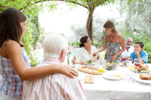 Multigenerational family dining outdoors