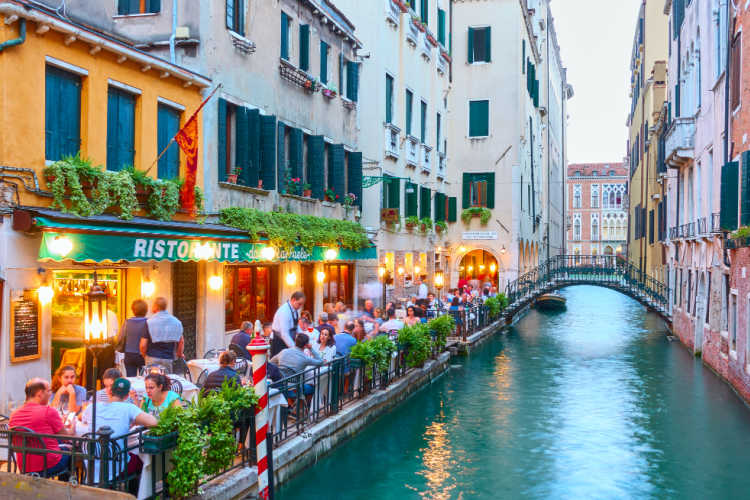 Italy with family restaurant canal Venice